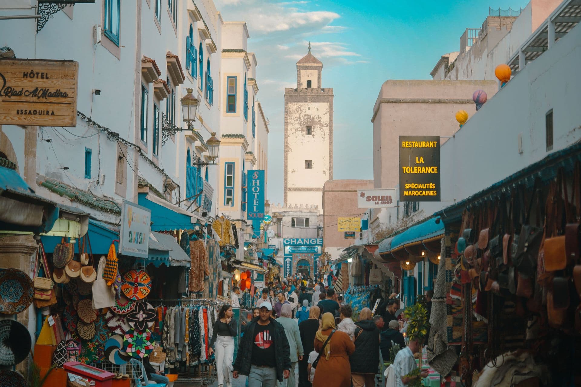 Bustling scene of Essaouira's Medina street market, showcasing local trade and culture.